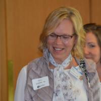 An alumna enjoying conversation